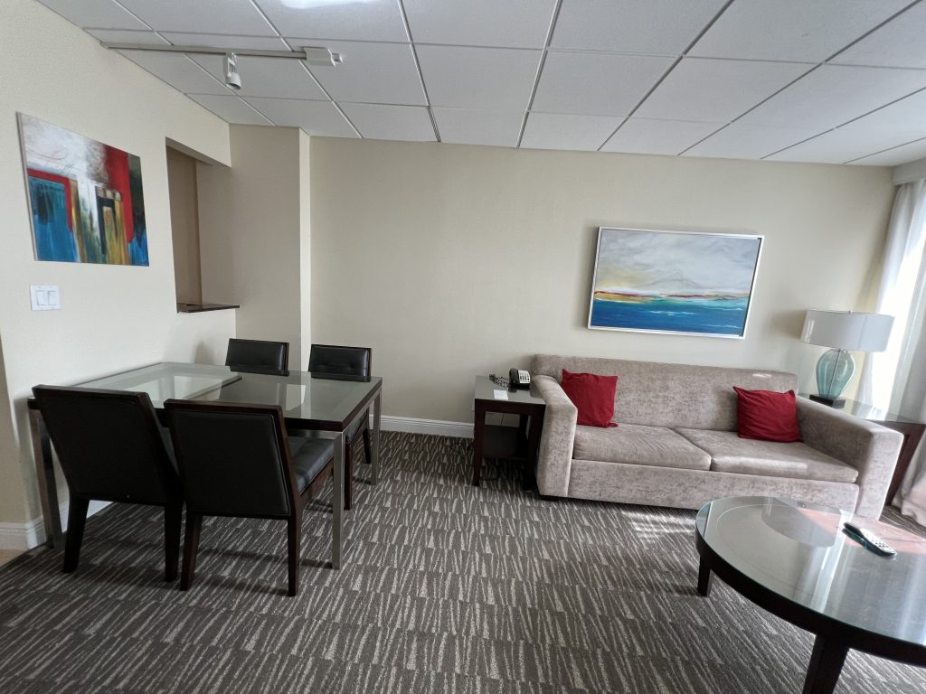 Living and dining area room tour Fort Lauderdale Cruise Hotel Review — GalleryOne DoubleTree Suites by Hilton