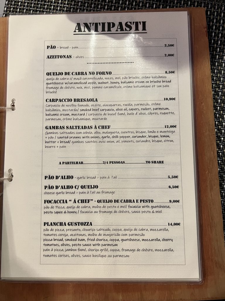 Menu with prices at Gusto'zza Pizzeria in Quarteira, Portugal