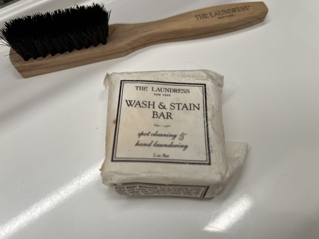 The Laundress Wash & Stain Bar and brush — How to do wash clothes on a Cruise