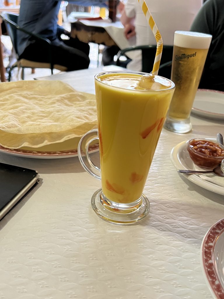 Mango Lassi with Yellow Stripe Paper Straw at Natraj Indian Tandoori in Vilamoura