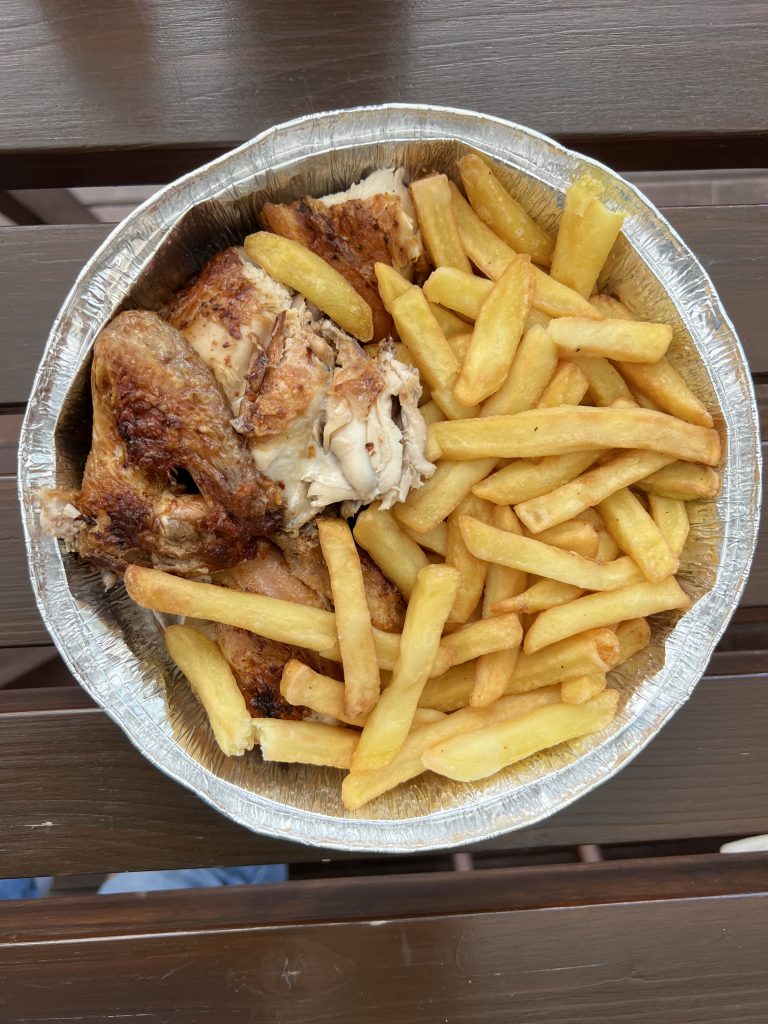 Piri Piri Chicken with Fries in a takeaway container from Rei do Churrasco Review Quarteira, Portugal