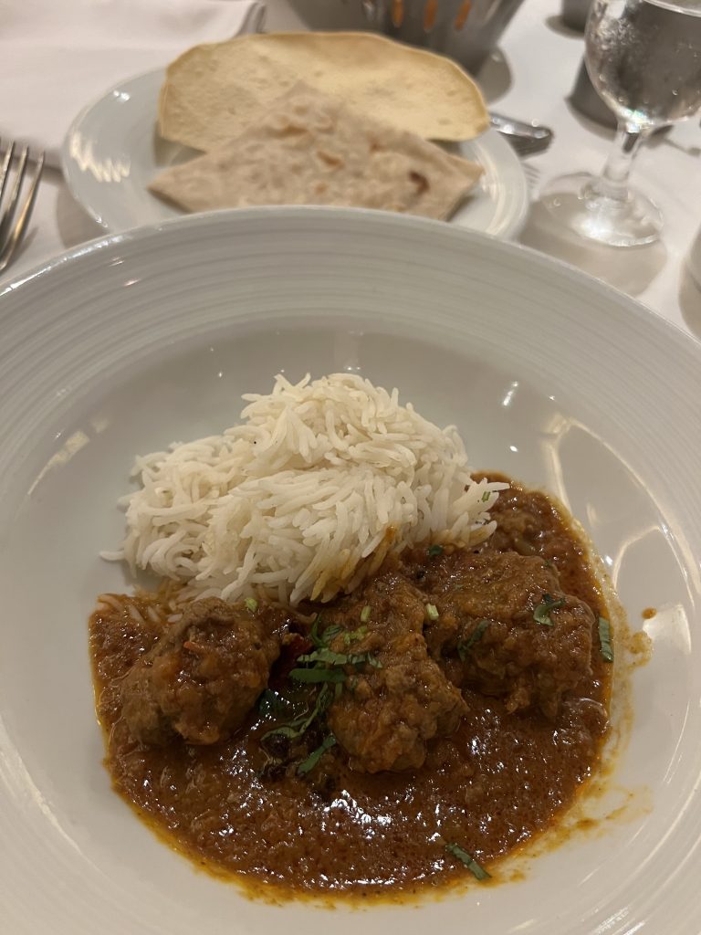 Indian curry with rice, papadam, and naan bread — Royal Caribbean Food on Independence of the Seas
