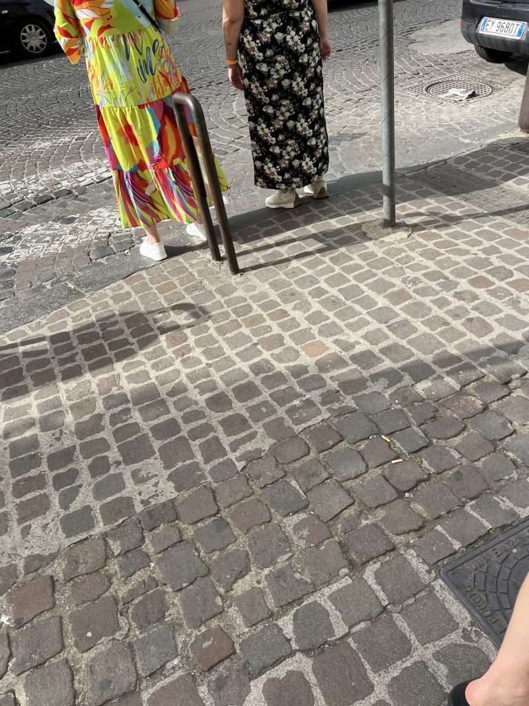 Two women wear white sneakers with dress in Naples — One Day in Naples Cruise Port 