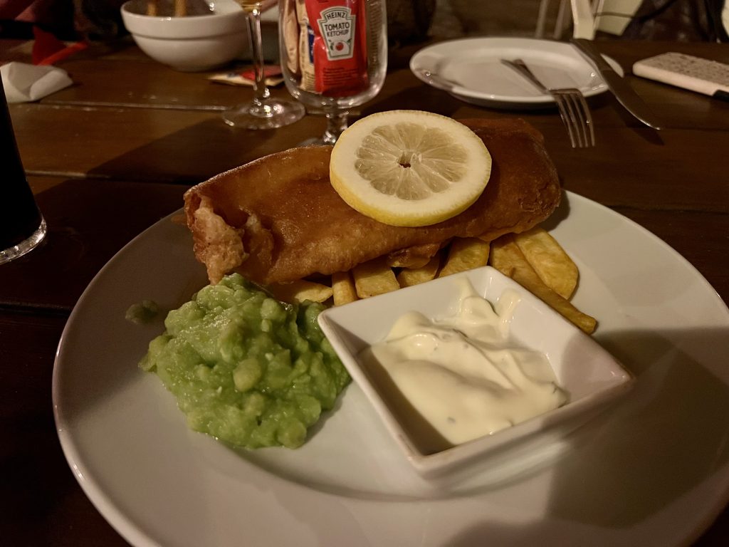Fried fish with French fries and mushy peas at The Black Anchor Tavira Restaurant Reviews