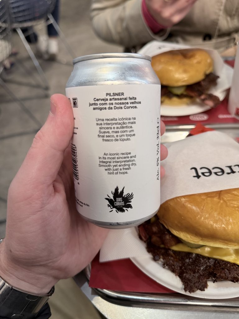 View of Street Smash Beer Can with Burgers in Background | Street Smash Burger Lisbon Review Alvalade Photos | Best Smash Burger in Lisbon?