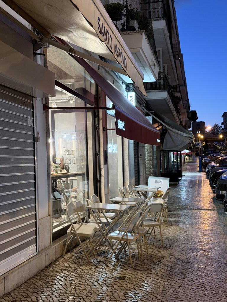 Sidewalk View tables and chairs in front of Street Smash Burger Lisbon Review Alvalade Photos | Best Smash Burger in Lisbon?