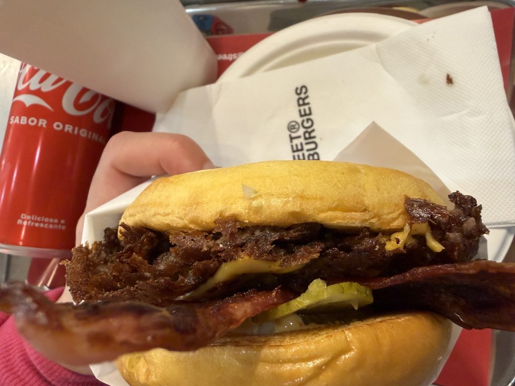 Street Smash Burger Lisbon Review Alvalade Photos | Side view of bacon smash burger with cheese, bacon, and pickles | Best Smash Burger in Lisbon?