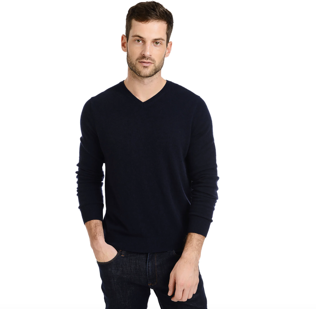 A man wearing a V Neck Cashmere Sweater from Mott & Bow