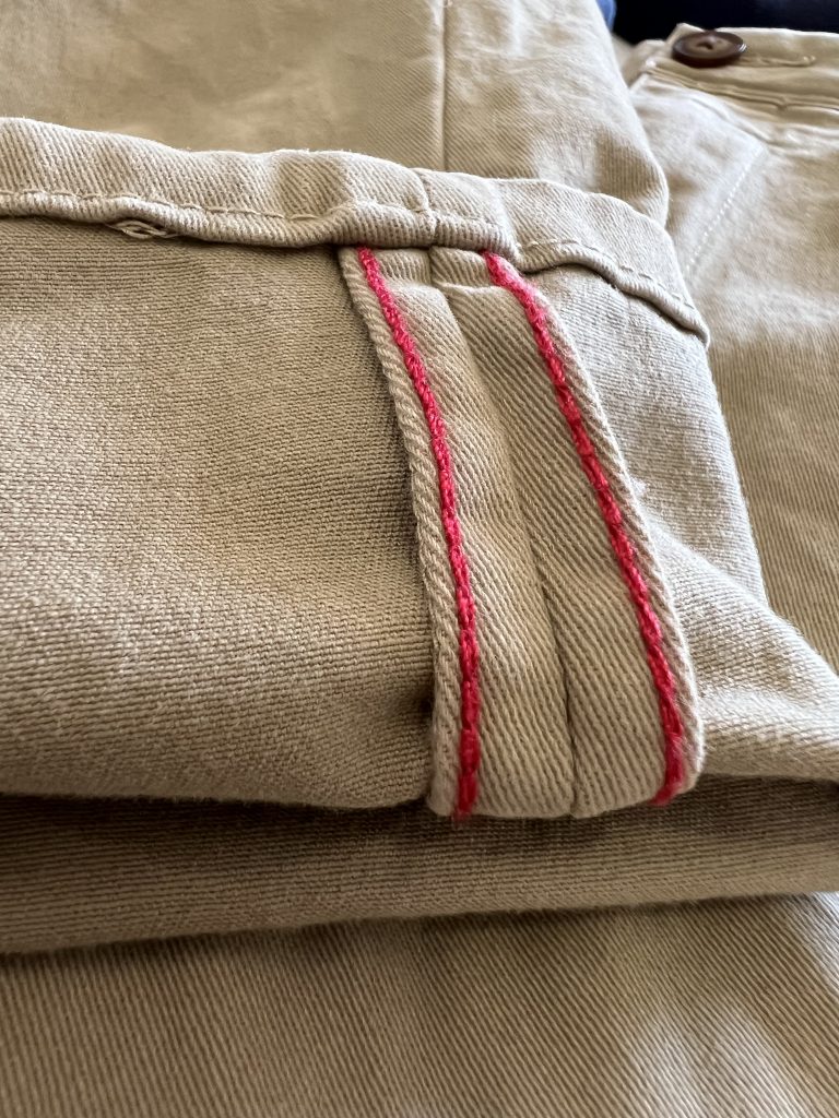A close up of the finishings and red stitching on Mott & Bow khaki chinos. Mott & Bow Review