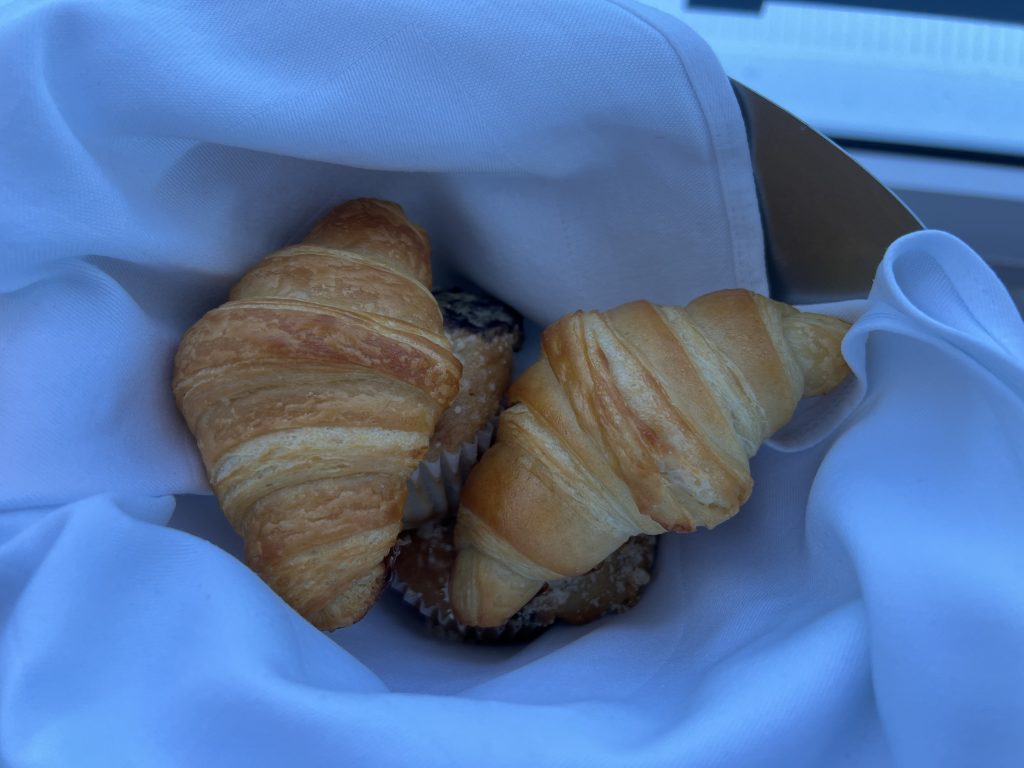 View of pastry basket with blueberry muffins and croissants  in Nassau, Bahamas | Celebrity Ascent Review Western Caribbean Itinerary
