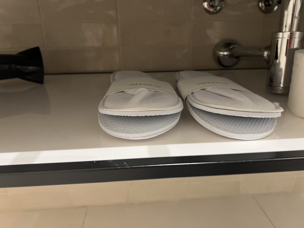 Hyatt Regency Lisbon Review Photos — Standard Queen Room Slipper Shelf Under Bathroom Sink | Portugal Travel Blog