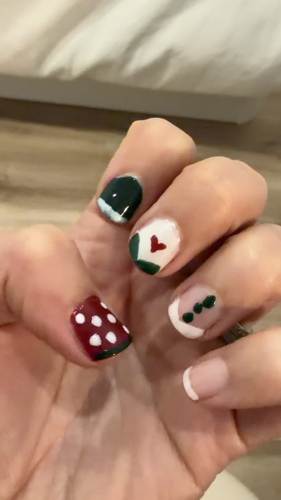 Manucurist World of Wonders Collection Nail Art Ideas Thin Forest Green French Tip over white sparkly nail polish (Bliss) with red heart (amour)