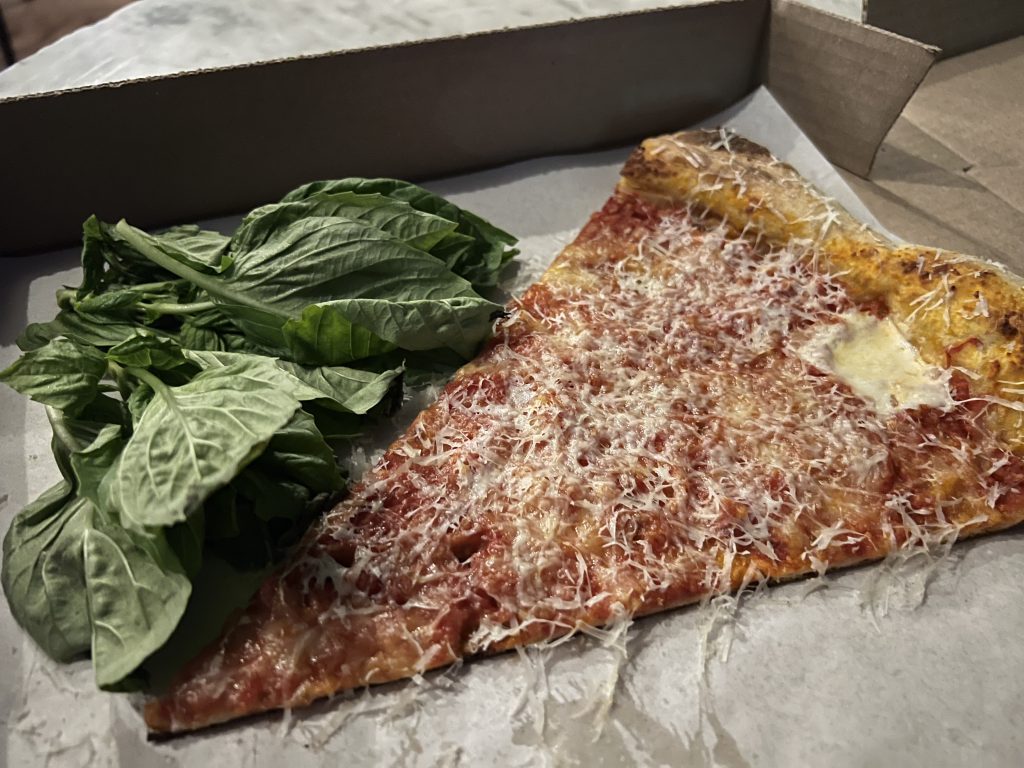 Miami Slice Review Photos — Margherita Pizza Slice with grated Parmesan and Bunch of Basil Inside Pizza Box | Miami Restaurant Review